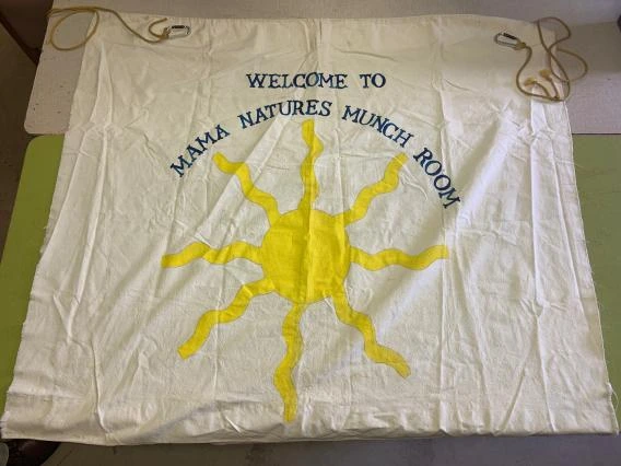“Welcome to Mama Natures Munch Room” banner