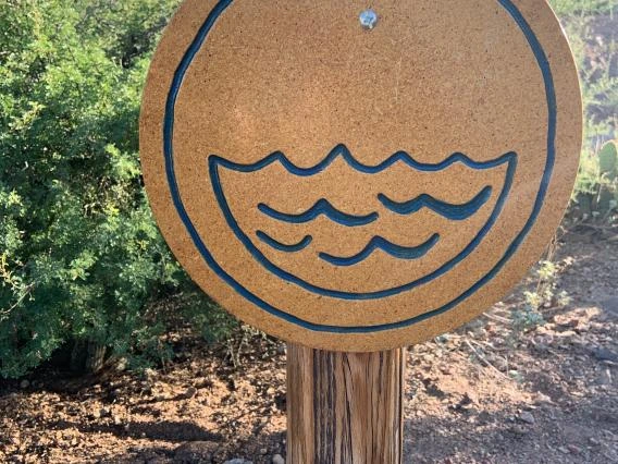Water sign on post with locks