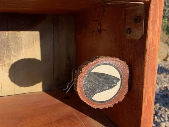 Mural logo attached to shelf unit