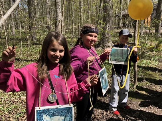 Three participants demonstrating the Munchline